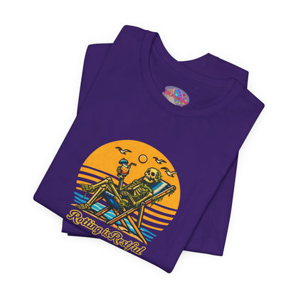 Purple t-shirt with a skeleton design and 'Riding is Restful' text on a white background